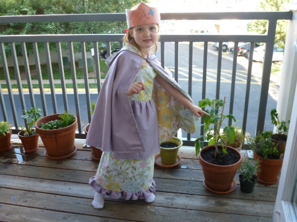 Aria in full birthday regalia - crown, cape and princess dress